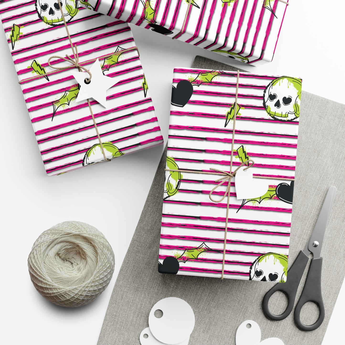 Pink striped wrapping paper with skull and lightning bolt patterns, ideal for edgy and unique gift wrapping.