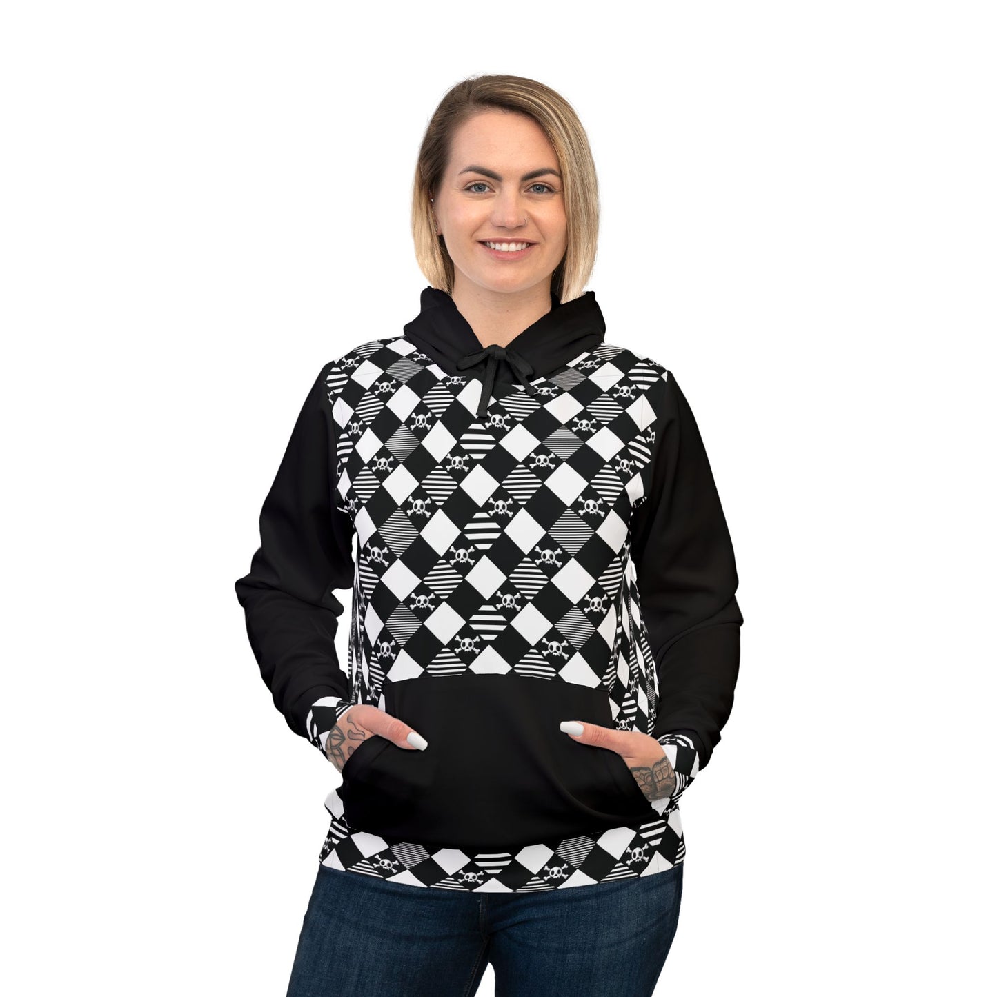 black and white diamond pattern skull and crossbones all over print hoodie showing a woman with tattoos on her hands and blonde hair warming up her hands