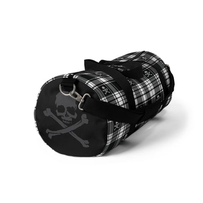 Black and White Flannel Patterned Skull and Crossbones Duffel Bag left side small with strap hanging 